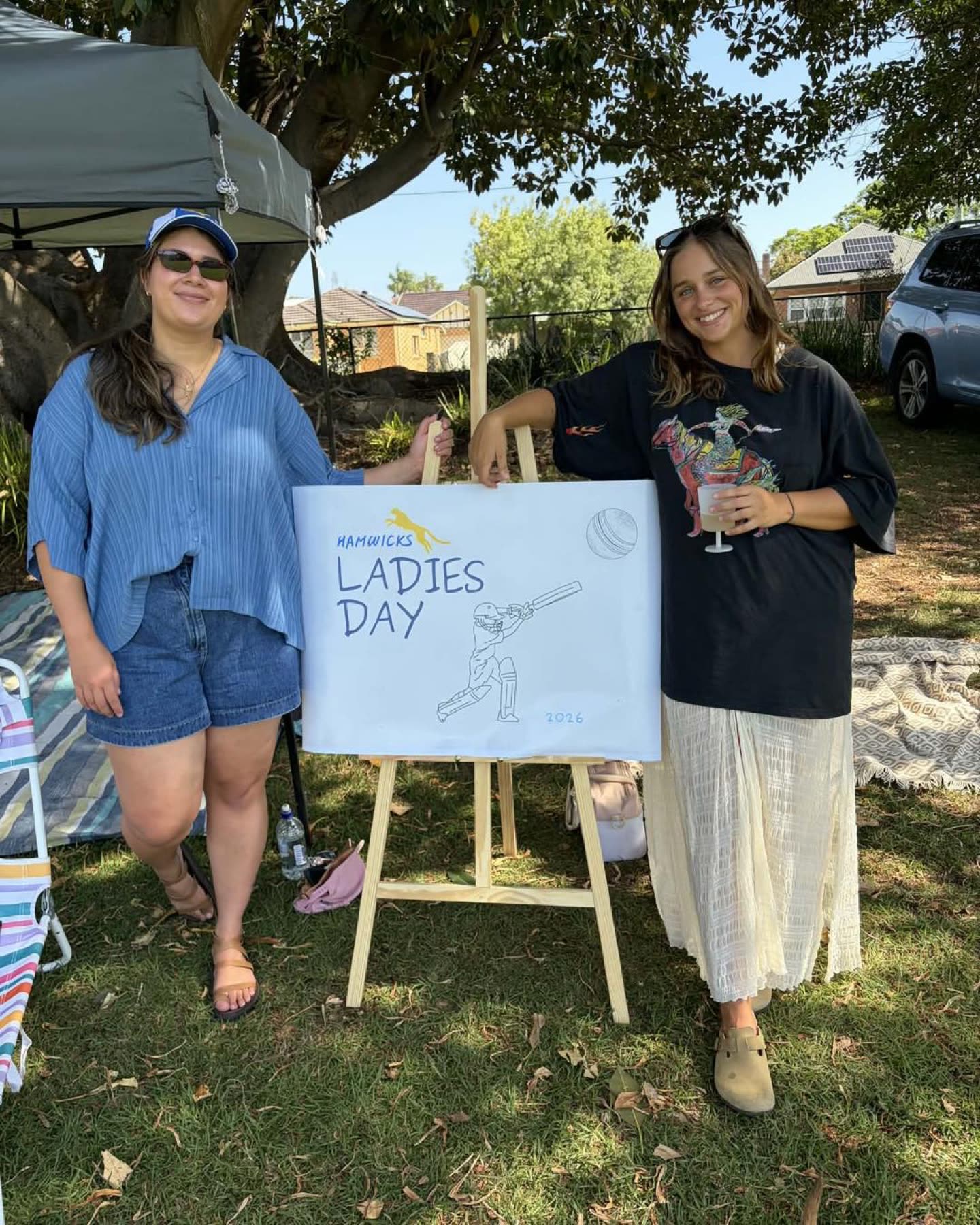 Supporters beside the Ladies Day sign